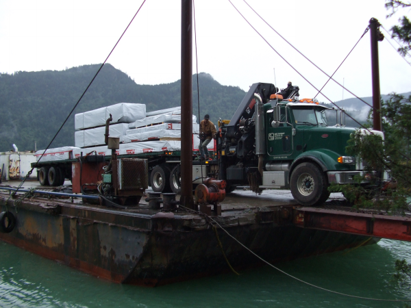 Tamlin Log Cabin Packages-Harrison Lake BC Project-barge_material_unloading-a