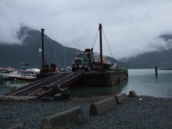 Tamlin Log Cabin Packages-Harrison Lake BC Project-barge_truck_loading